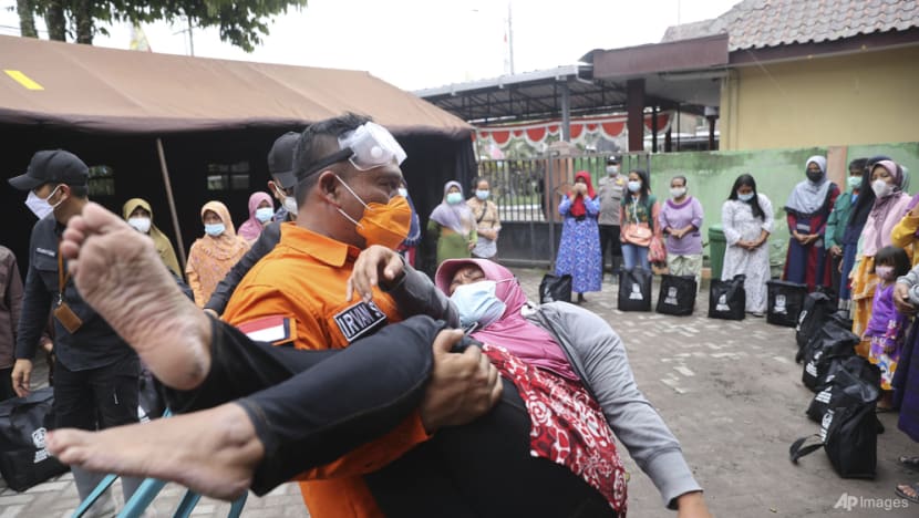 Smouldering debris, mud hinder Indonesia volcano rescue; at least 14 dead