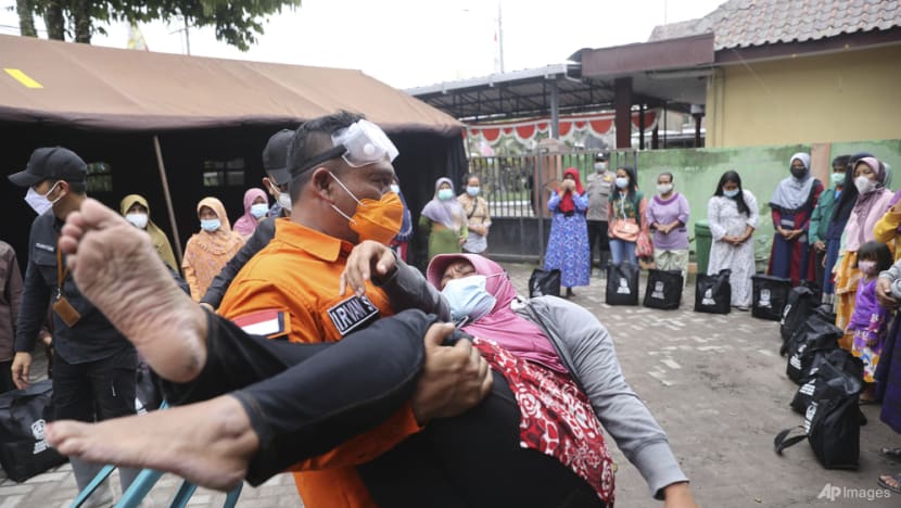 Smouldering debris, mud hinder Indonesia volcano rescue; at least 14 dead Smouldering debris, mud hinder Indonesia volcano rescue; at least 14 dead