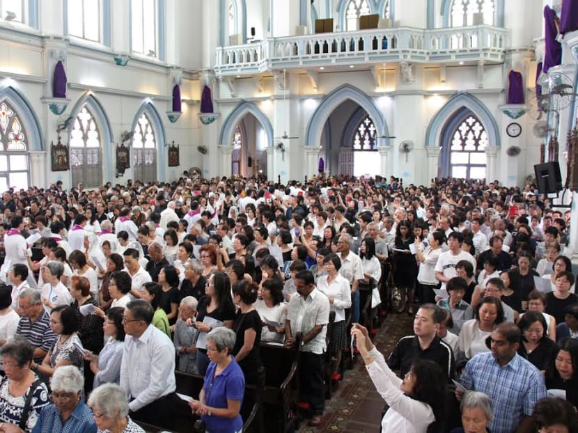 The crowd at the Saint Joseph's Church who came to pay tribute to the late Mr Lee Kuan Yew. Photo: Low Weixin
