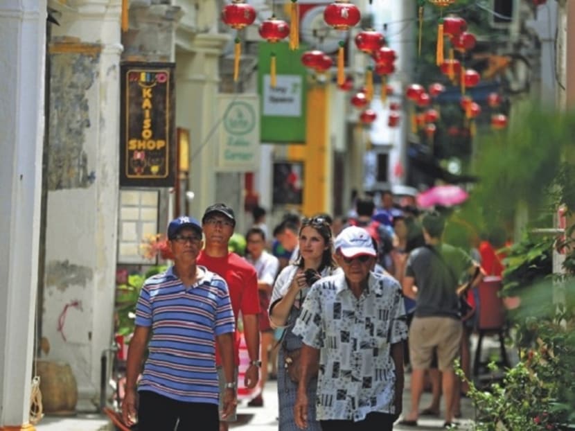 Tourists take in the sights at Lorong Panglima, popularly known as Concubine Lane, in Ipoh. Photo: Malay Mail Online