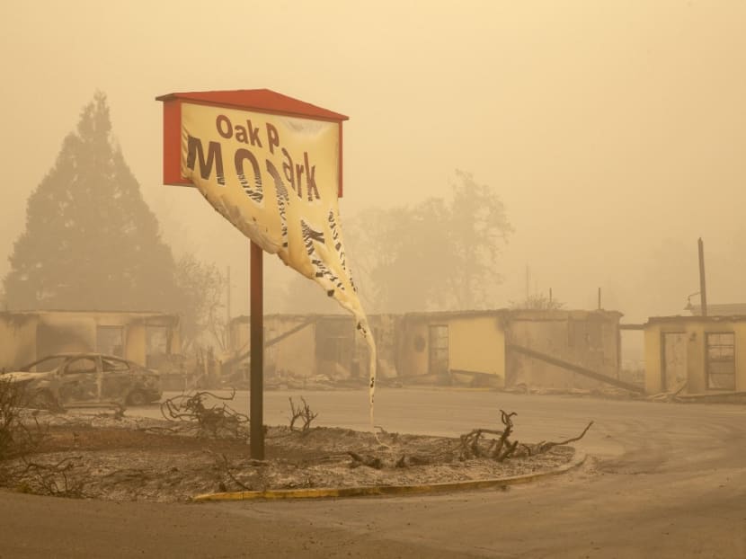 The melted sign of the Oak Park Motel destroyed by the flames of the Beachie Creek Fire is seen in Gates, east of Salem, Oregon on Sept 13, 2020.