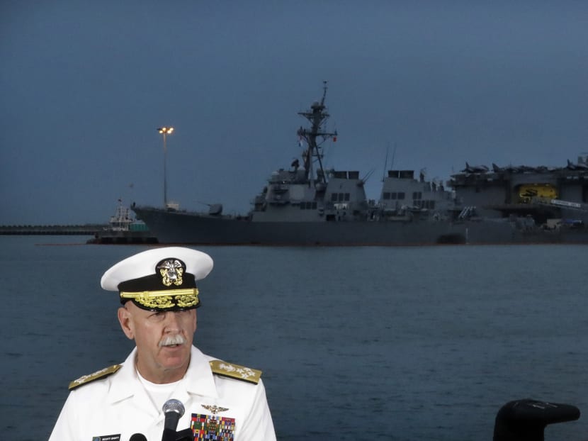 Commander of the US Pacific Fleet, Scott Swift answers questions during a press conference with the USS John S McCain, left, and USS America docked in the background at Singapore's Changi naval base. Photo: AP
