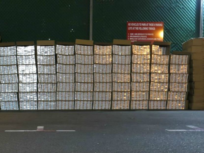 A total of 3,438 cartons of duty-unpaid cigarettes that were hidden in picture frames were seized from the loading bay area of a self-storage facility in Singapore on Dec 7, 2016. Photo: Singapore Customs