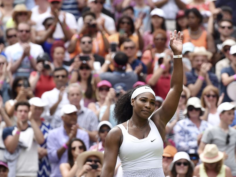 Serena Williams celebrates after winning her match against her sister Venus. Photo: Reuters