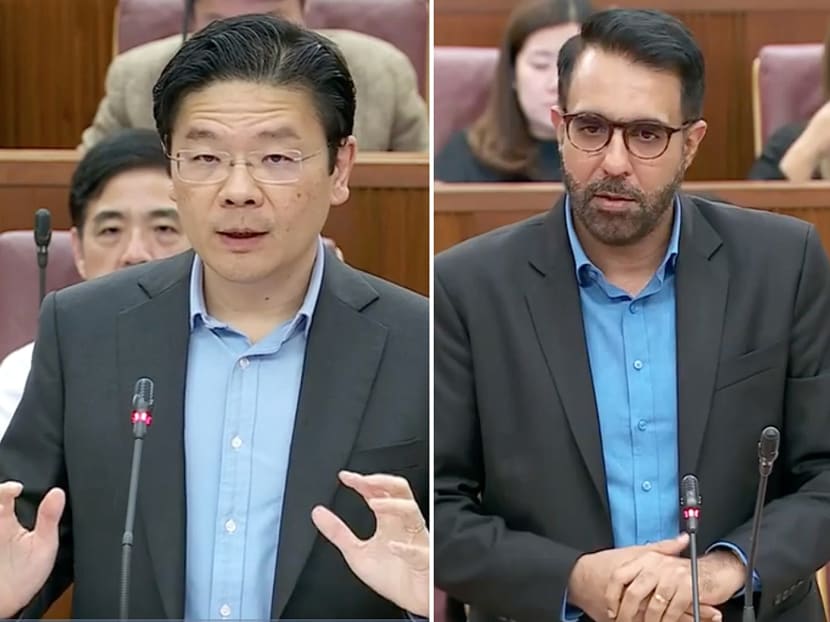 Deputy Prime Minister Lawrence Wong (left) and Mr Pritam Singh (right), Leader of the Opposition and Workers' Party chief, speaking in Parliament on March 21, 2023.