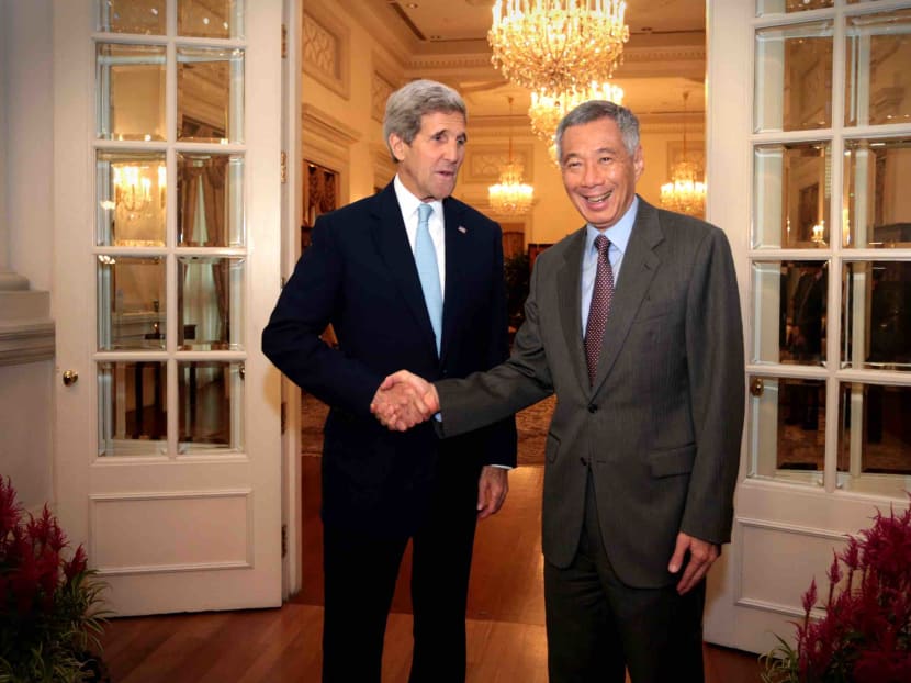 Singapore's PM Lee Hsien Loong greeting US Secretary of State John Kerry at the Istana on Aug 4, 2015. Photo: Jason Quah