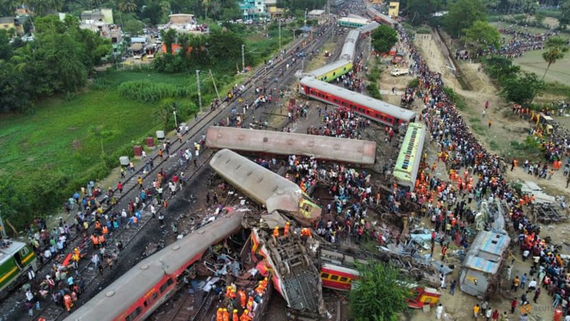 Families, rescuers search for victims of India's worst train crash in decades