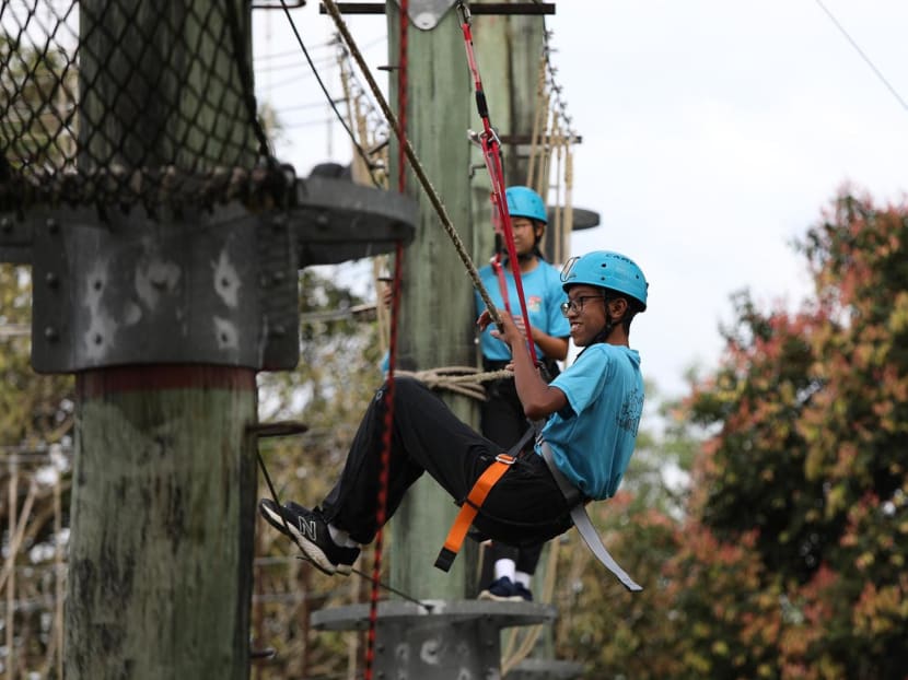 Students manoeuvre a tower circuit at the Jalan Bahtera Outdoor Adventure Learning Centre on Feb 1, 2023. 