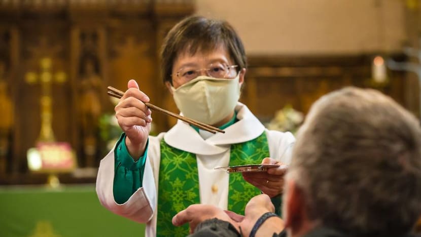 UK-based Singaporean priest goes global after giving Communion with 'lo hei' chopsticks