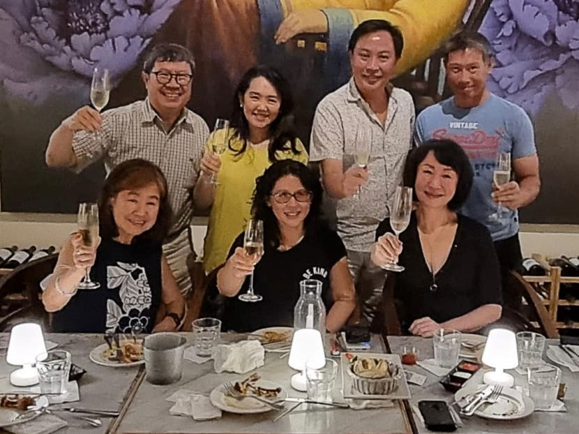 Dr Ronald Yeoh (back row, far left) with his cousins, raising their glasses to actress Michelle Yeoh’s Best Actress Oscar win on March 13, 2023.
 
