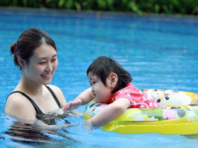 Three-year-old Yujia, who was born with oesophageal atresia and has to be fed through a tube, is seen swimming with her mother, Madam Jamie Chua, 31, on June 2, 2017. Photo: Esther Leong/TODAY