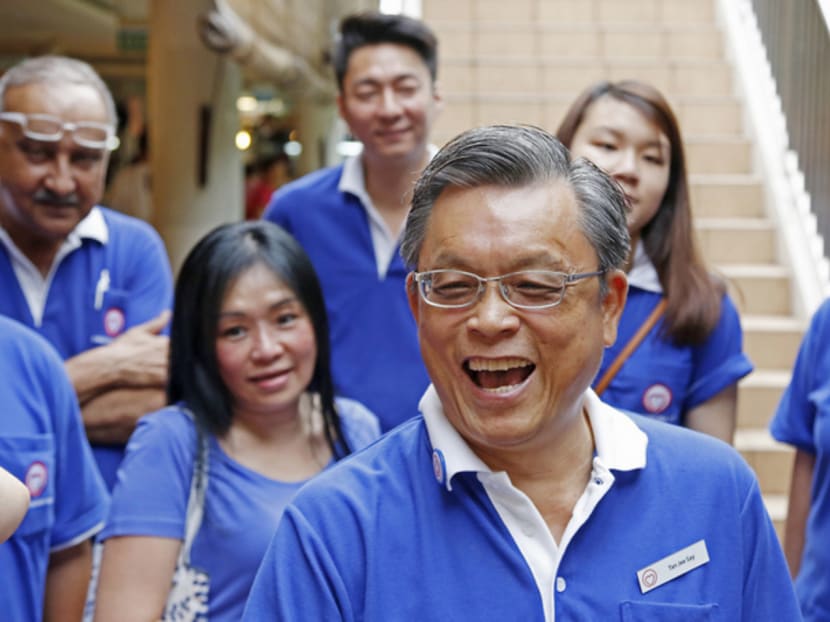Tan Jee Say (centre) from Singaporeans First party, seen here with other party members duriong a walkabout at Tiong Bahru market on Aug 1. Photo: Raj Nadarajan