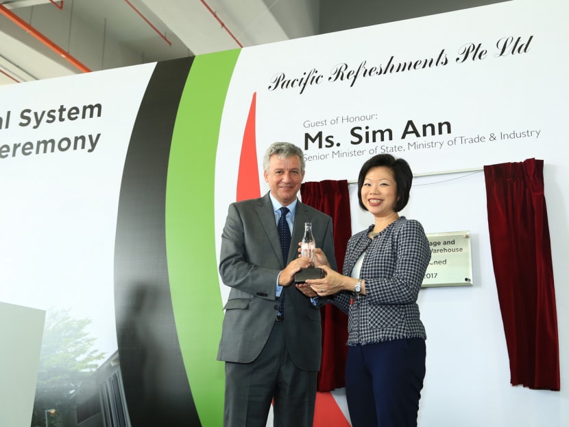Mr John Murphy, president, Asia Pacific Group, The Coca-Cola Company and Ms Sim Ann, Senior Minister of State, Ministry of Trade and Industry. Coca-Cola — which has a global portfolio comprising more than 500 brands — officially opened a S$79 million storage and distribution centre in Tuas yesterday. Photo: Handout