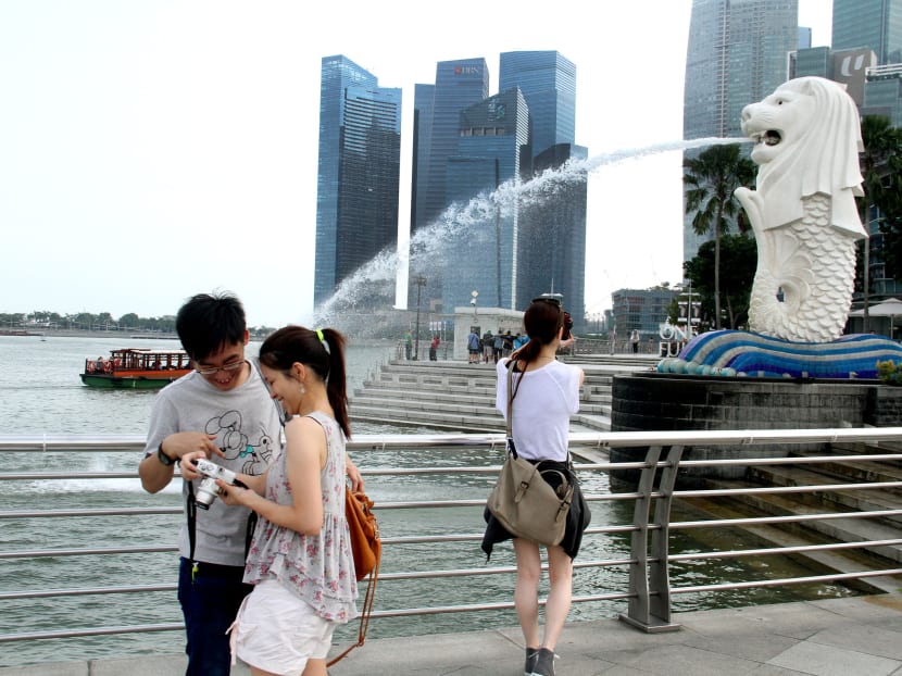Many Chinese tourists — some of whom are seen here at Merlion Park — have avoided South-east Asia since the MH370 incident. Photo: Geneieve Teo