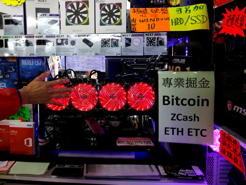 A cryptocurrency mining computer equipped with four cooling fans at a computer mall in Hong Kong. Mr Ravi says MAS assesses that the nature and scale of crypto token activities in Singapore do not currently pose a significant risk to financial stability, but it is monitoring the situation closely. Photo:Reuters