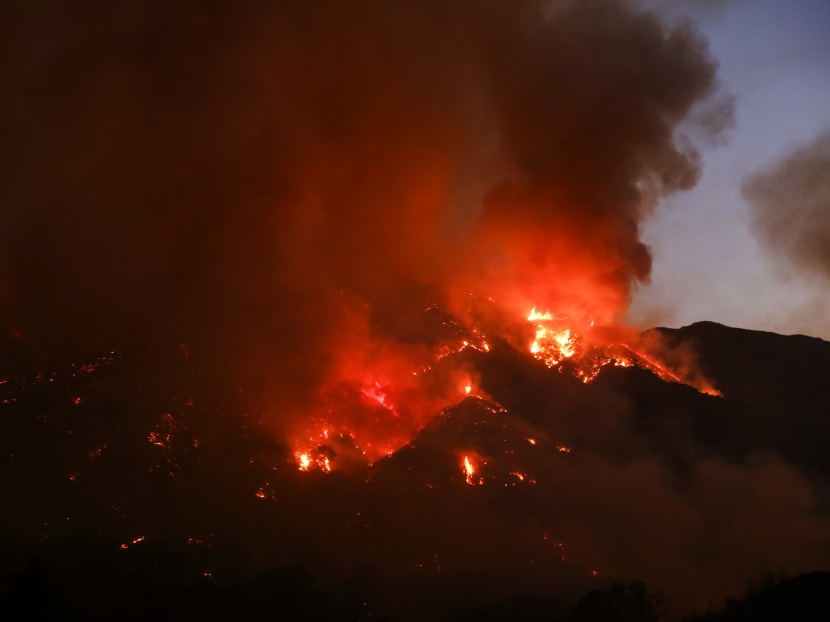 Flames flare up from a wildfire near Placenta Canyon Road in Santa Clarita, on July 24, 2016. Photo: AP