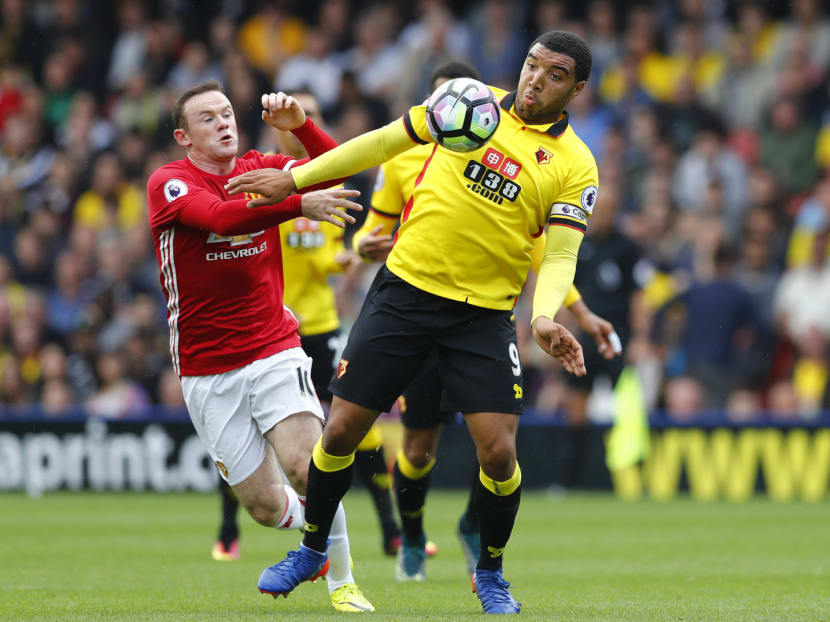 Almost wholly peripheral to the action, Rooney (left) was about as effective as an oak wardrobe. Photo: Reuters