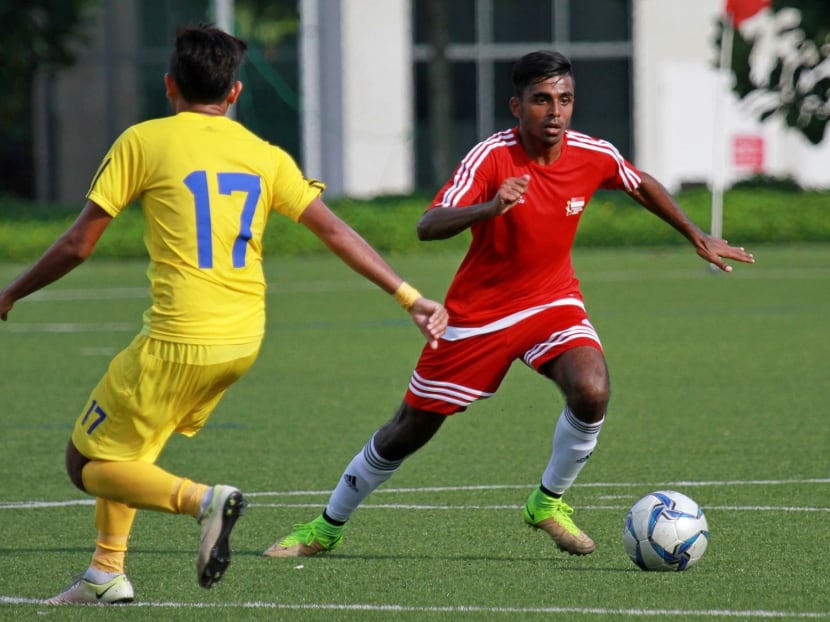 The author playing in an Asean University Games football match against Cambodia in July 2016.