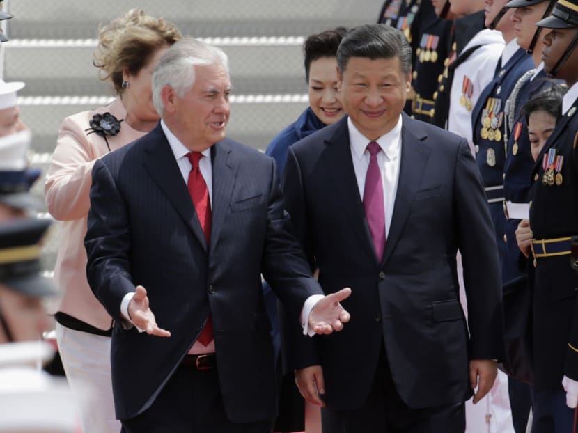 File photo of Secretary of State Rex Tillerson (L) walking with Chinese President Xi Jinping at the Palm Beach International Airport, April 6, 2017, in West Palm Beach, Fla.  Photo: AP