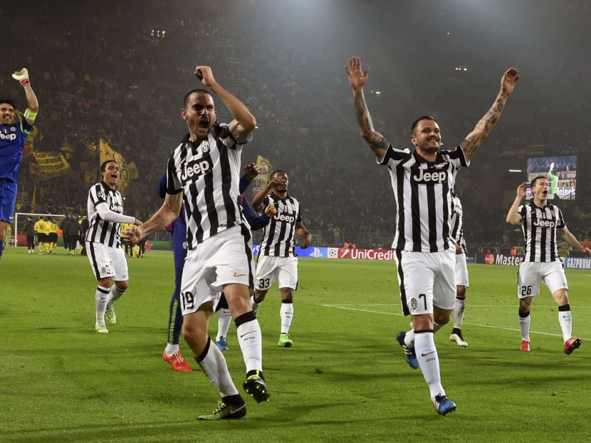 Players of Juventus celebrate after their Champions League round of 16 second leg soccer match against Borussia Dortmund. Photo: Reuters