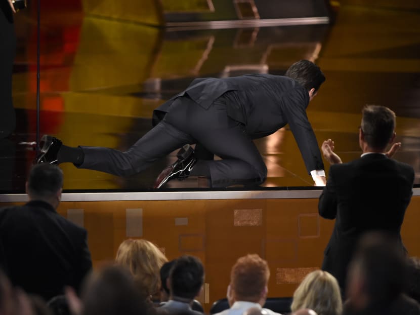 Jon Hamm rolls on to stage to accept the award for outstanding lead actor in a drama series for Mad Men at the 67th Primetime Emmy Awards on Sunday, Sept. 20, 2015. Photo: AP