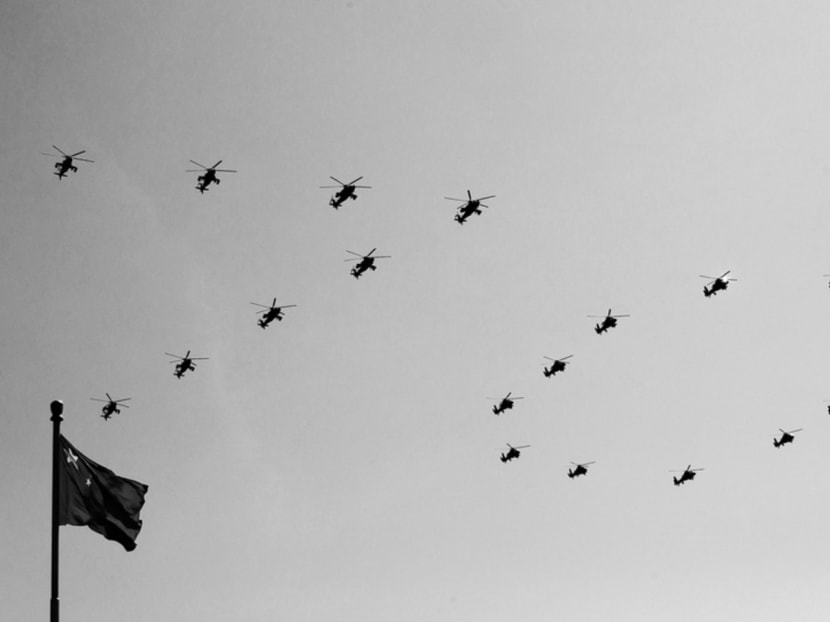 Chinese Army attack helicopters form the number “70” as they fly past a national flag during a military parade to commemorate the 70th anniversary of the end of World War II in Beijing yesterday. The Chinese people are resolved to pursue friendly relations with all other countries. Photo: Reuters