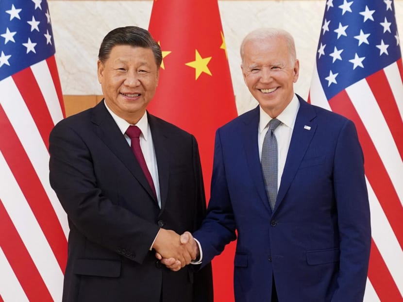 US President Joe Biden shakes hands with Chinese President Xi Jinping as they meet on the sidelines of the G20 leaders' summit in Bali, Indonesia on Nov 14, 2022.