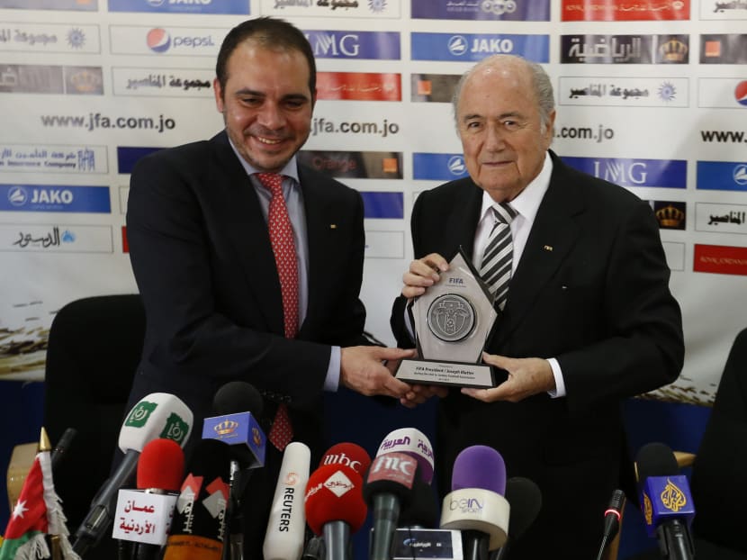 FIFA President Sepp Blatter (R) gets a gift from Jordan's Prince Ali Bin Al Hussein (L), FIFA's vice president Asia, chairman of the Jordan Football Association, after their a joint news conference in Amman in May last year. Photo: Reuters