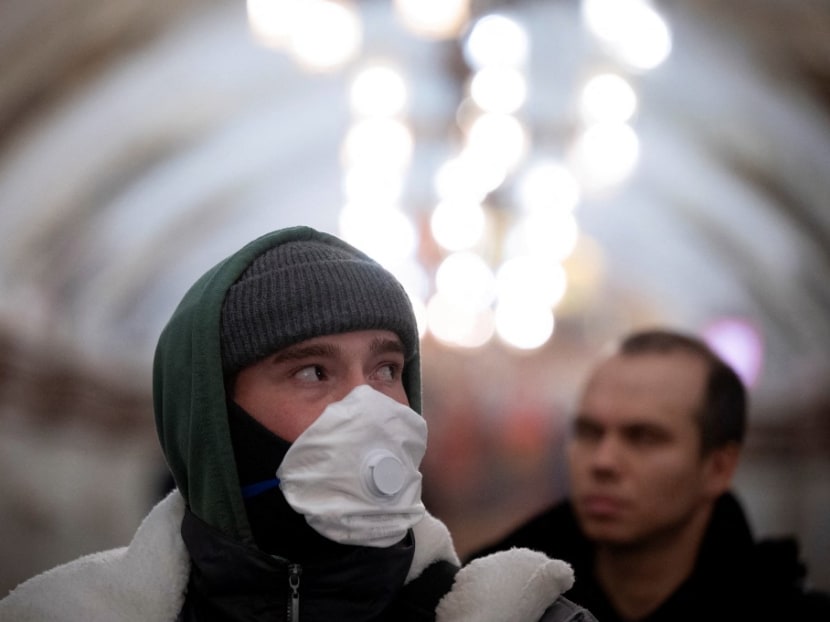 A man wearing a face mask walks at a metro station in Moscow on Nov 22, 2021, amid the ongoing Covid-19 pandemic.
