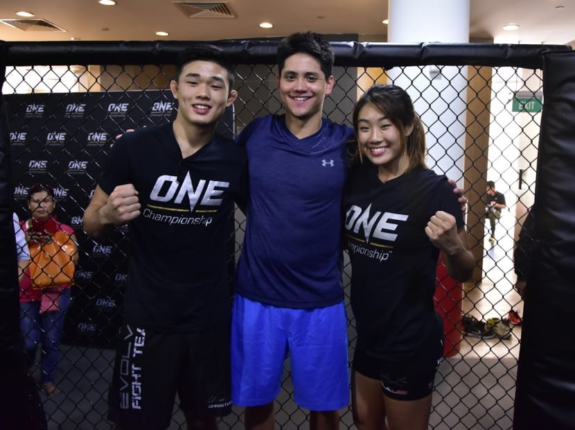 Joseph Schooling (centre) with MMA siblings, Christian (left) and Angela. Photo: ONE Championship