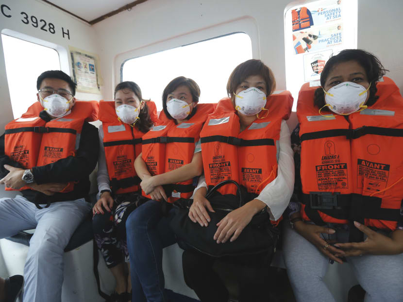 People wearing N95 masks. Photo: Ernest Chua/TODAY