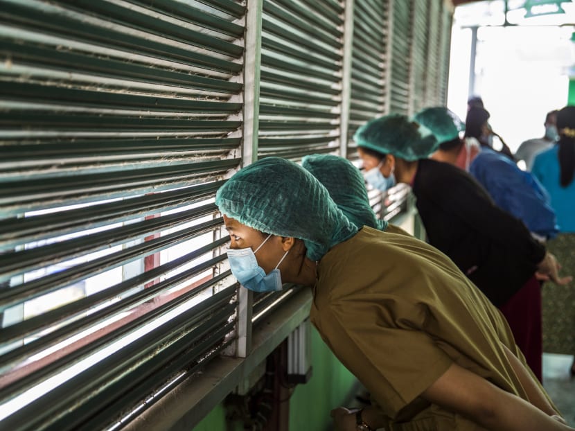 Medical staff watch from a hospital rooftop as security forces crack down on protestors in Mandalay, Myanmar, on Feb 28, 2021. The country is now one of the most dangerous places in the world to be a medical worker. Medical staff watch from a hospital rooftop as security forces crack down on protestors in Mandalay, Myanmar, on Feb 28, 2021. The country is now one of the most dangerous places in the world to be a medical worker.