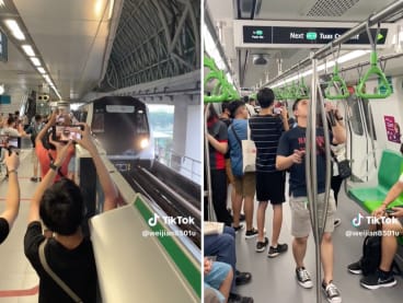 Images from a TikTok video posted on June 4, 2023 showing crowds of train enthusiasts gathered at Tuas Link MRT Station for the launch of SMRT's new Alstom Movia R151 train.