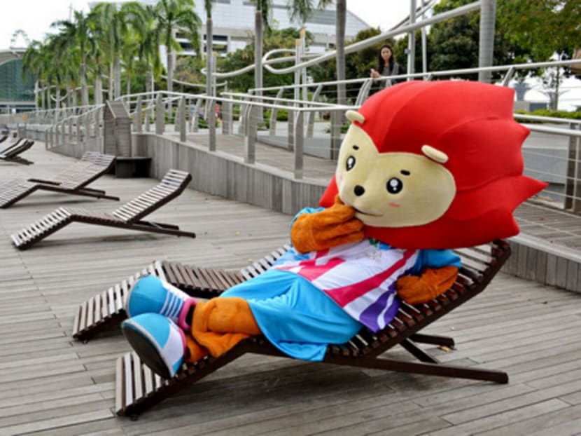 Nila the Sea Games Mascot takes a break along the benches at Marina Bay.