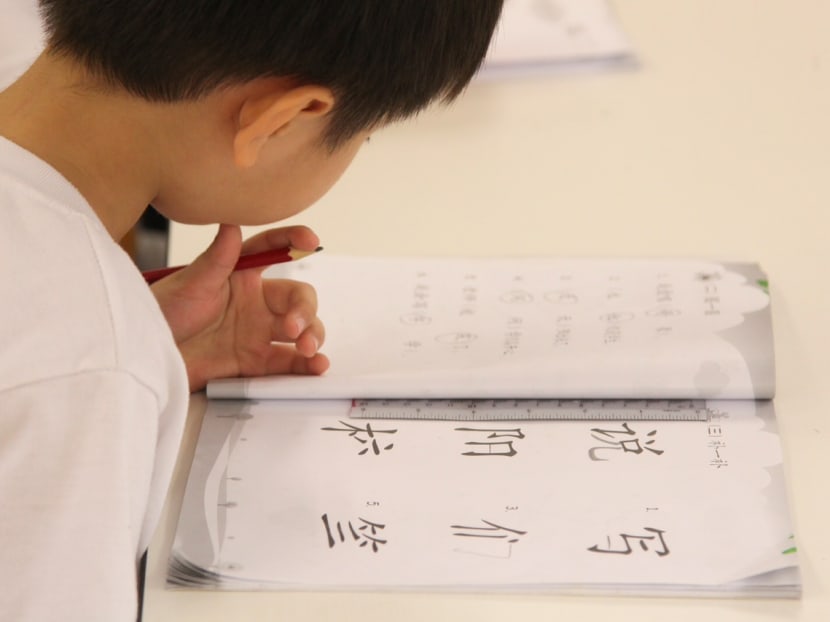 A student working on his mandarin language assignment. TODAY file photo
