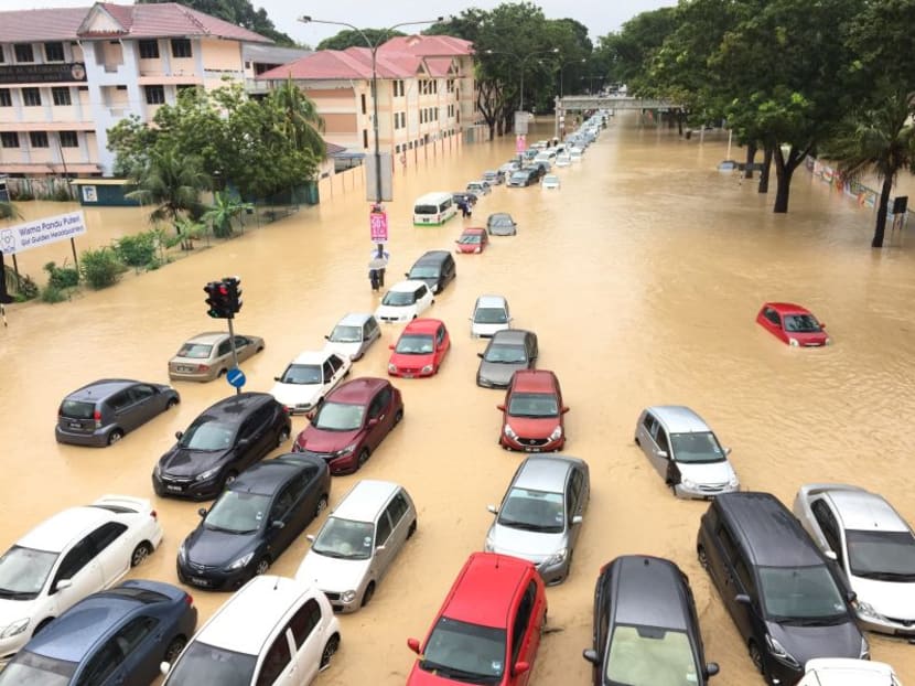 Vehicles are seen stuck here in the flood at Jalan Air Itam in George Town, Penang on Friday. Photo: Malay Mail Online