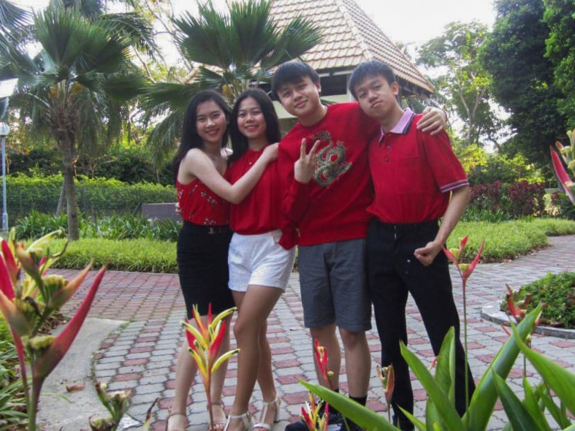 The author (far left), seen here with her siblings, says creating a family budget has helped them keep track of see each other’s expenditures and encouraged them to examine their expenses more critically.