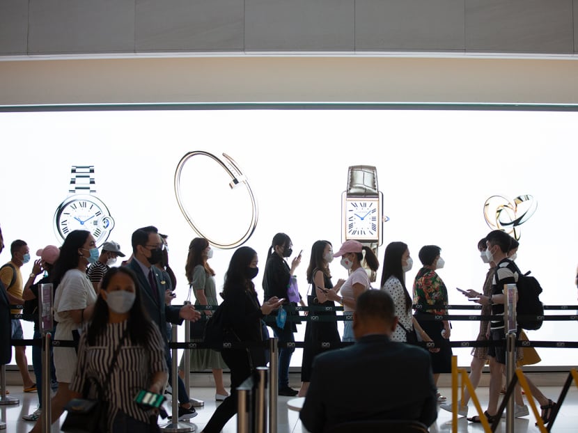 Shoppers at Ion Orchard mall in a file photograph taken in February 2022.