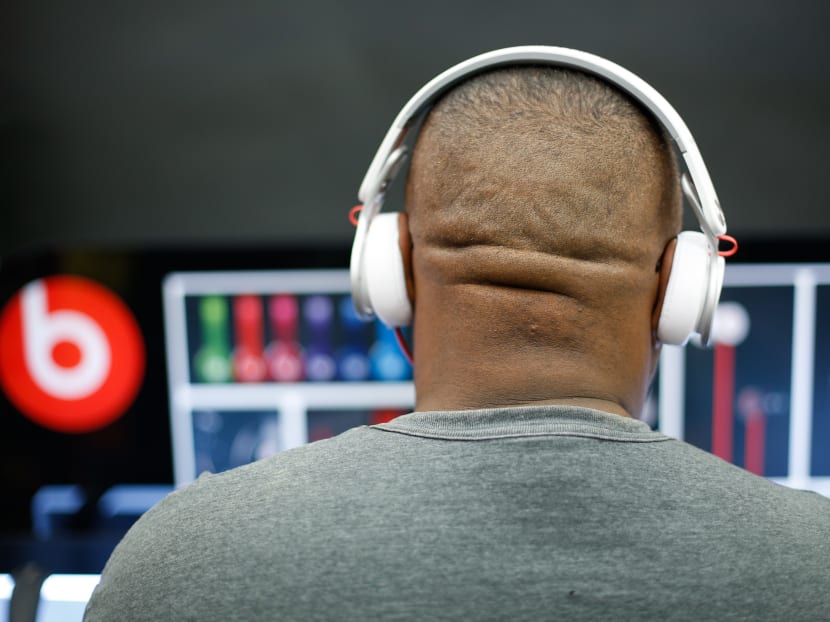 In this Nov 22, 2012 file photo, Byron Hall tests out Beats headphones at Super Target in Dallas. Apple acquired Beats Electronics for US$3 billion a year ago, and as part of the deal also got its hand on the company’s Beats Music subscription service. Photo: AP/Dallas Morning News