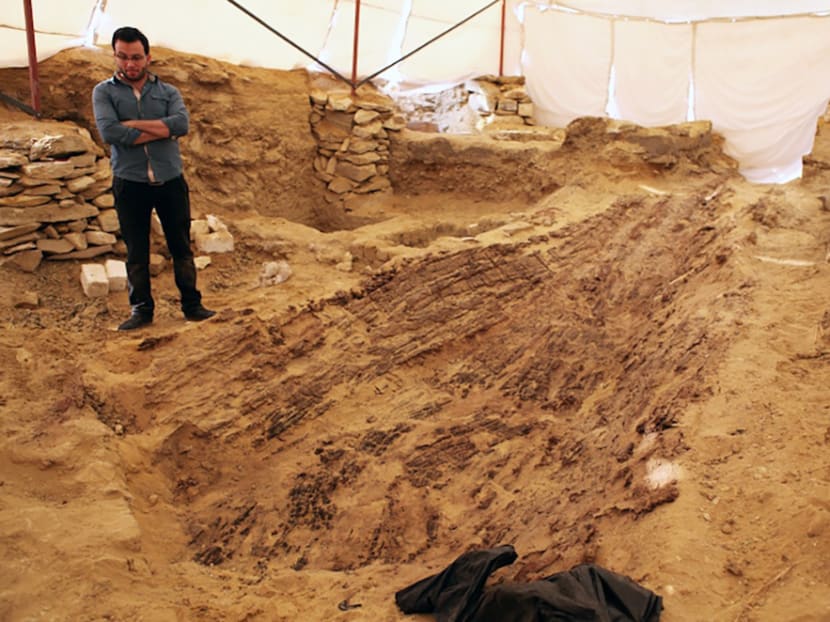 A worker at the site where Czech archaeologists discovered an ancient funerary boat in the Old Kingdom necropolis of Abu Sir, south-west of the capital Cairo. Photo: AFP