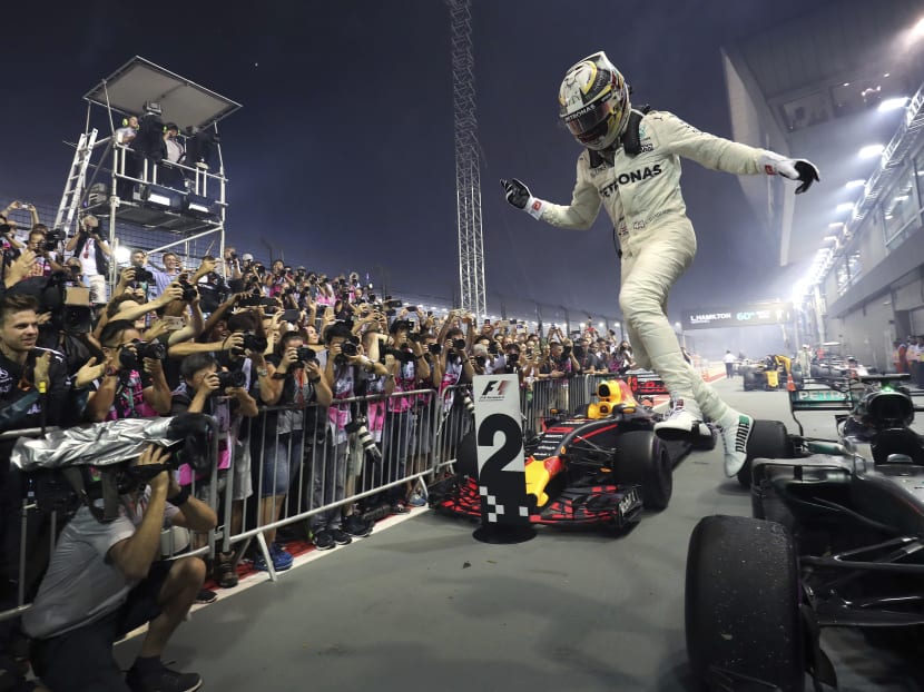 Lewis Hamilton leaps for joy after he wins the 2017 edition of the Singapore Grand Prix. Photo: AP