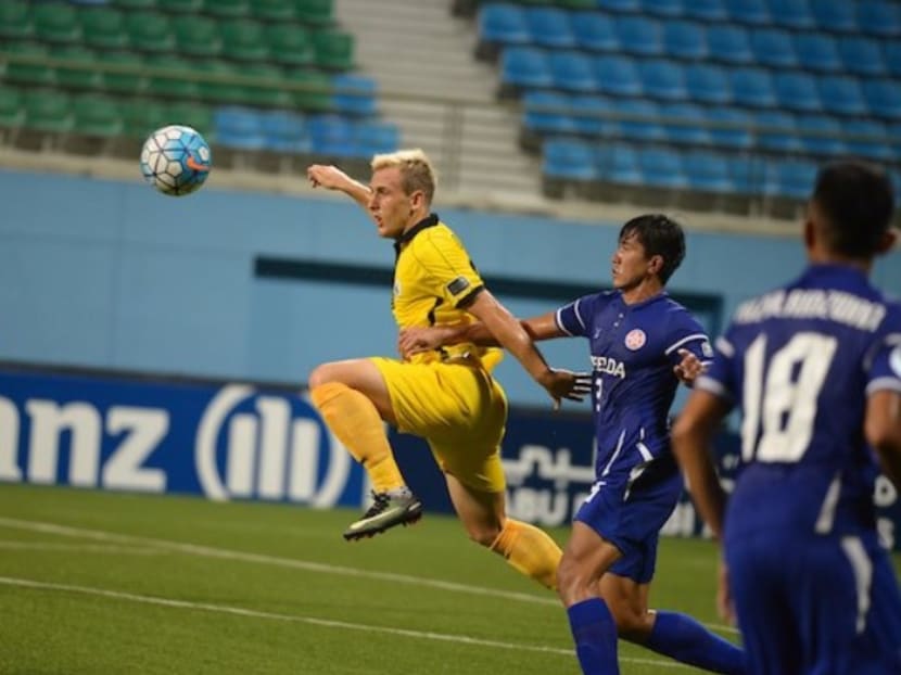 Tampines Rovers' Ivan Dzoni (in yellow) getting away from Felda United players. The Stags have made a winning start to their AFC Cup campaign. Photo: AFC
