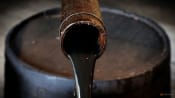 Oil opens mixed as economic fears pressure prices