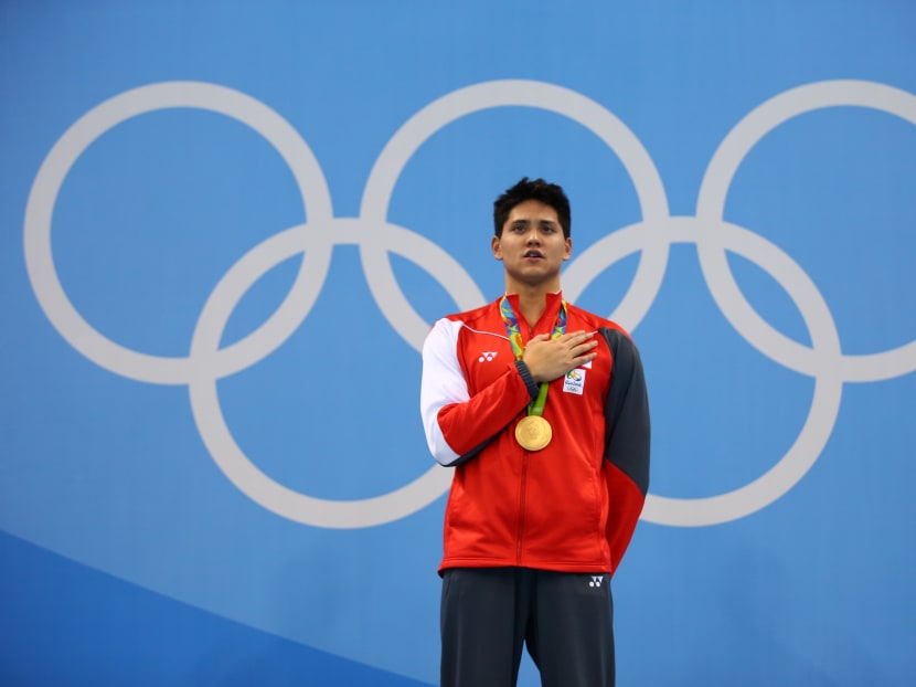 Joseph Schooling sings the national anthem after he was crowned the 100m butterfly champ at the Rio Olympics. Photo: Getty Images
