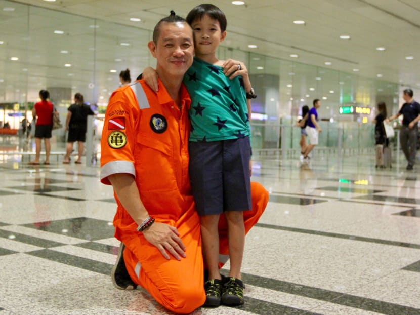 50-year old rescue diver Douglas Yeo with his son Dominique, on 13 July 2018. Mr Yeo was part of the Thai cave rescue operation. 50-year old rescue diver Douglas Yeo with his son Dominique, on 13 July 2018. Mr Yeo was part of the Thai cave rescue operation.
