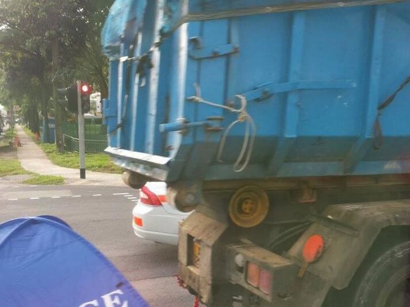 The scene of the accident between a tipper truck and motorcycle at Tuas on Jan 9, 2014. Photo: Channel NewsAsia