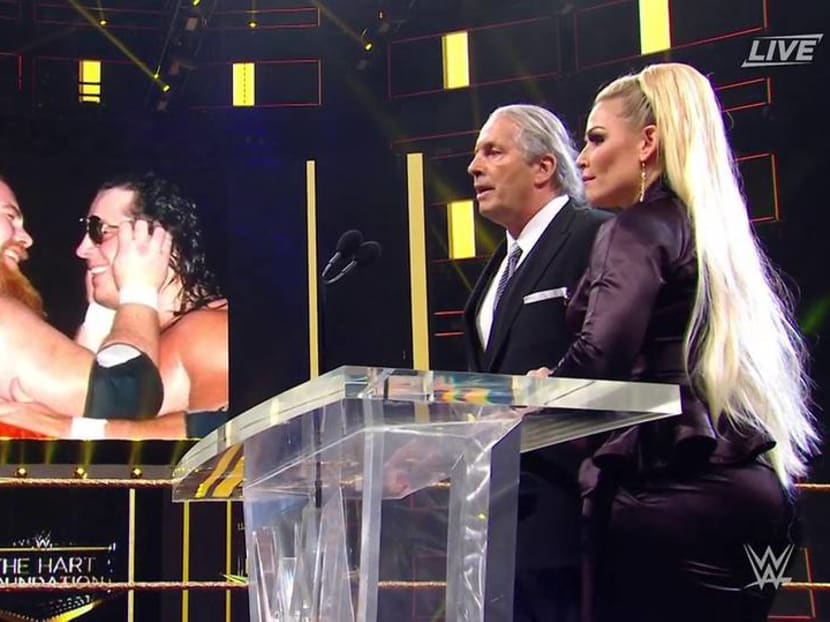 Wrestling star Bret 'The Hitman' Hart tackled to the ground while giving Hall of Fame speech Wrestling star Bret 'The Hitman' Hart tackled to the ground while giving Hall of Fame speech