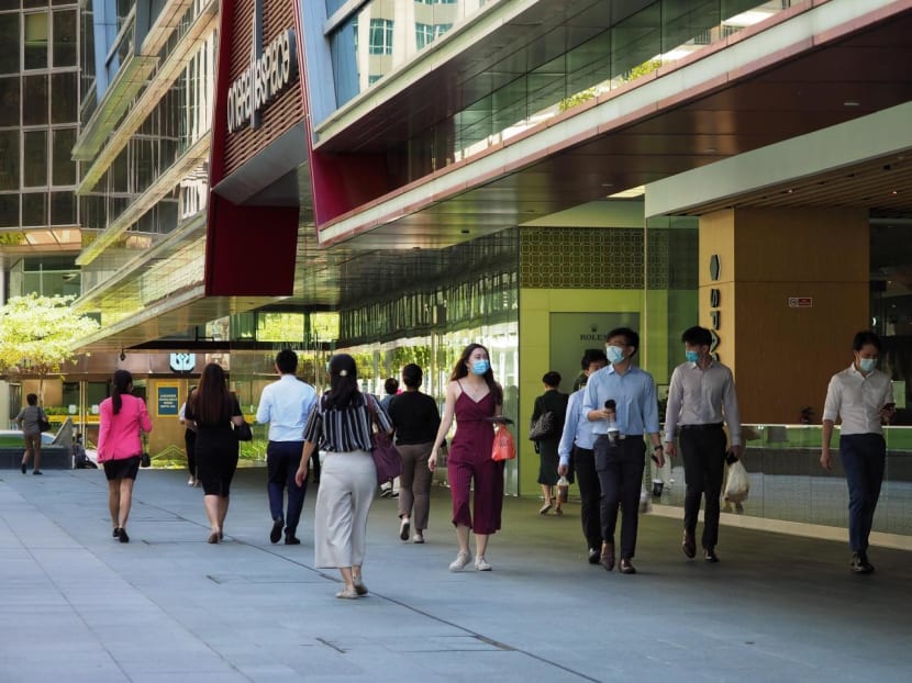People walking during lunchtime in the financial district of Singapore. People walking during lunchtime in the financial district of Singapore.