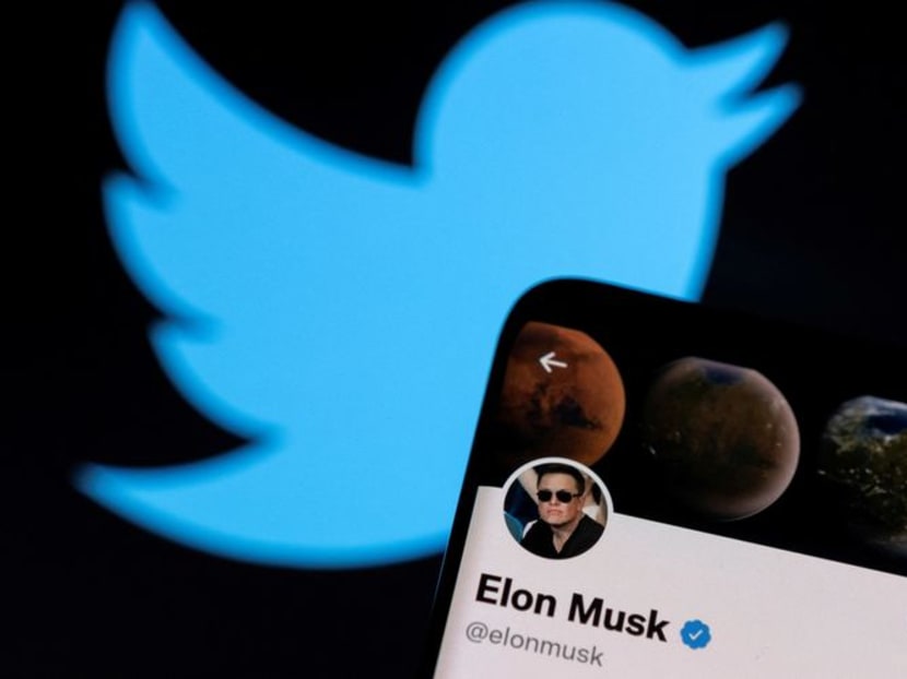 FILE PHOTO: Elon Musk's Twitter account is seen on a smartphone in front of the Twitter logo in this photo illustration taken, April 15, 2022. REUTERS/Dado Ruvic/Illustration/File Photo
