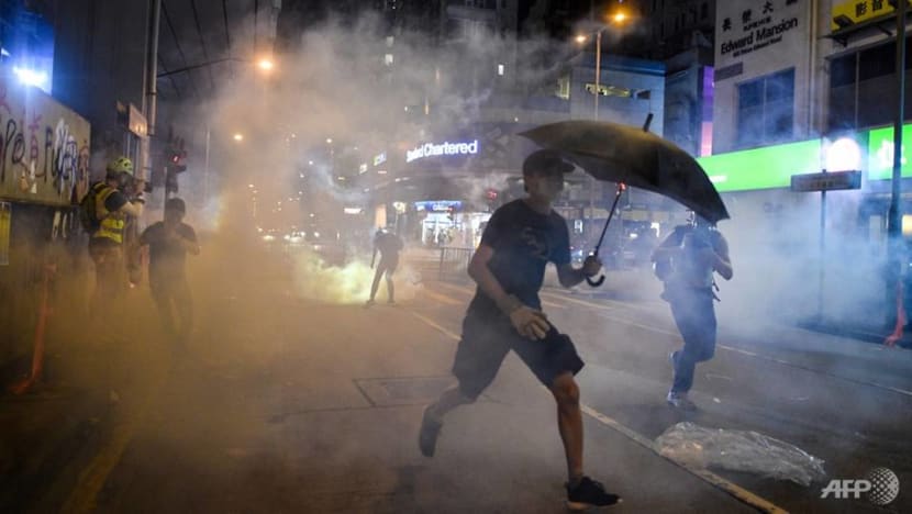Hong Kong police fire tear gas at protesters outside Prince Edward MTR station